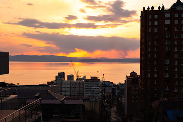 Panoramic view of the city of Vladivostok against the sunset.