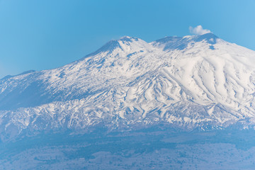 Fototapeta premium View of Snow Capped Mt. Etna at Sunset from Sicily, Italy