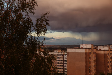 Dark rainy clouds. Stormy weather. Beautiful landscape. Nature concept. Apocalyptic sky. The end of...