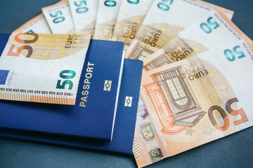 Foreign passport and money. Travel concept photo. Holidays and new countries. Euros banknotes.