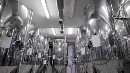 Slow Motion of Containers Aligned in a Brewery - Powered by Adobe