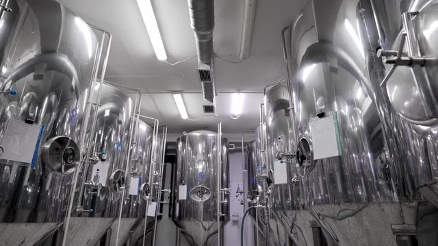 Slow Motion of Containers Aligned in a Brewery