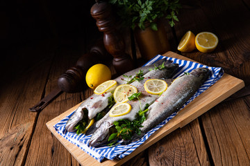 fresh trout with lemon and different herbs