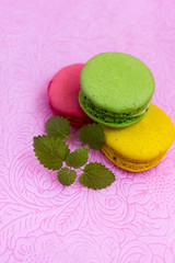 Macaroons fresh colorful close up. French dessert food background.