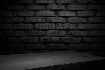cement floor in dark room with spot light. black background.