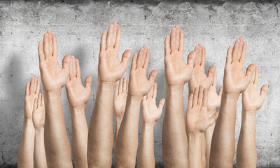 Row of man hands showing voting gesture