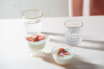 Morning healthy breakfast and berries on the white background. Side view