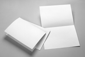 Blank half-folded booklet, postcard, flyer or brochure mockup template on gray background