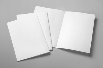 Blank half-folded booklet, postcard, flyer or brochure mockup template on gray background