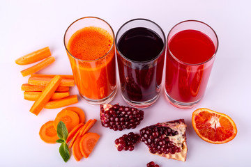 Bottles with different colorful juices. Healthy lifestyle