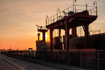 dam on the river at sunset