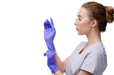 Beautiful female doctor or nurse wearing protective mask and latex or rubber gloves on white background isolated with copy space. Health care concept