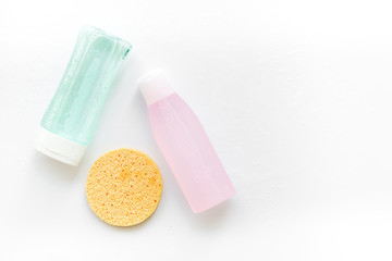 mycelial water , lotion and sponge for skin care on white background flat lay space for text