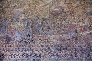 Stone Carving, all around on the wall at Angkor wat.