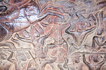 Stone Carving, all around on the wall at Angkor wat.