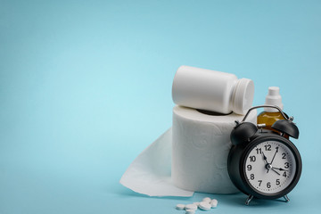Medicine, toilet paper and clock