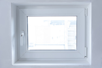 white plastic PVC window indoors close-up