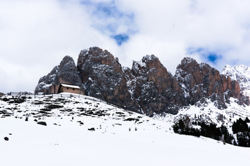 Hut refugio in winter landscape of the alps, Dolomites. Italy