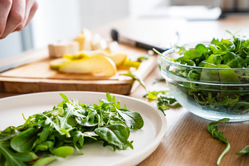 chef making salad on the kitchen