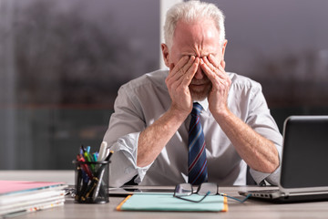 Portrait of tired businessman