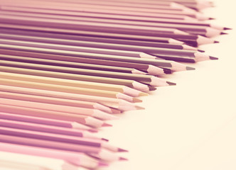 colored pencils lying in irregular row