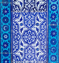 Texture of ceramic tiles in oriental East style. Turkish ceramic tiles lined on the wall. Old azulejo pattern floral ornament on floor. Ottoman traditional art. Moroccan portuguese mosaic background