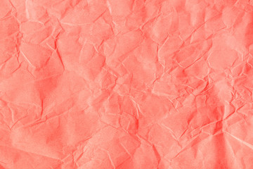 Crumpled orange-pink craft paper texture