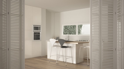 White folding door opening on modern white kitchen with island, stools, ribbon window and parquet floor, white interior design, architect designer concept, blur background