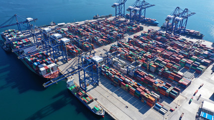 Aerial photo of industrial cargo container loading terminal located in mediterranean port
