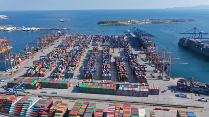 Aerial photo of industrial cargo container loading terminal located in mediterranean port