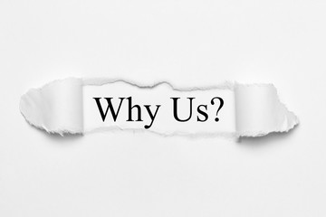 Why Us? on white torn paper