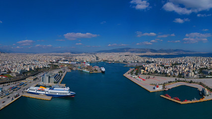 Fototapeta na wymiar Aerial drone bird's eye view of famous crowded port of Piraeus one of the largest in Europe where ships travel to popular Aegean destinations, Attica, Greece