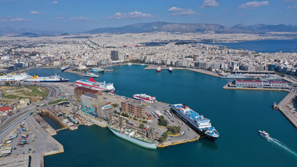 Fototapeta na wymiar Aerial drone bird's eye view of famous crowded port of Piraeus one of the largest in Europe where ships travel to popular Aegean destinations, Attica, Greece
