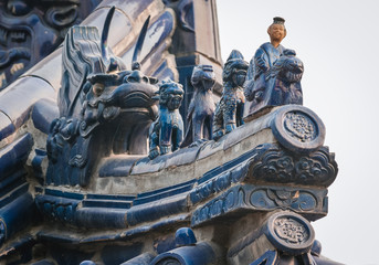 Close up on roof and wall details in Temple of Heaven, Beijing, China. Blue roof tiles symbolize...