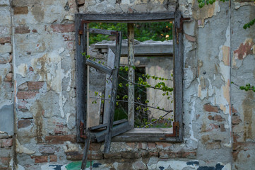 Fototapeta na wymiar Old house in a village with a broken wooden window.