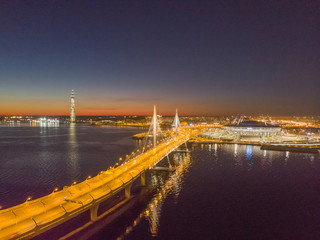 Saint-Petersburg, Russia. Aerial views to Gulf Finland. Skyscraper Lakhta center Gazprom headquarters. Stadium Zenith Arena at night. Illuminated by multi-colored lights the stadium at night.