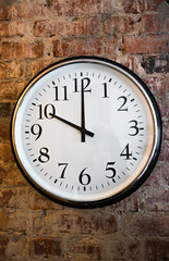 Classic Wall clock on brick wall