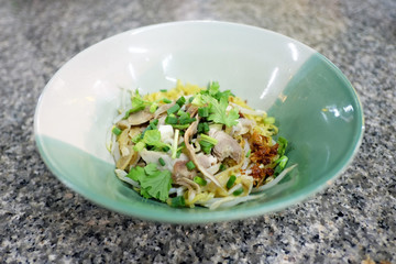 Dry chicken noodle asian street food.
