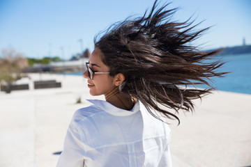 Happy excited tourist walking along promenade