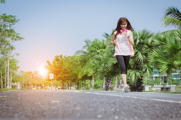 Asia woman exercise with happy on holiday.