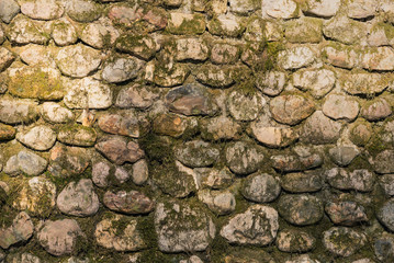 Old moss covered stone wall - beautiful vintage background