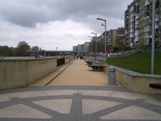 The image of the river embankment railing pavement pavement. Photo composition