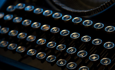 Vintage antique collectible typewriters close-up. Russian keyboards.