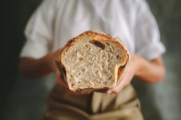 Acrylic prints Bread Female baker with fresh bread