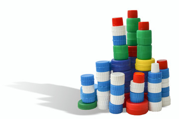 stacked plastic caps isolated on white background