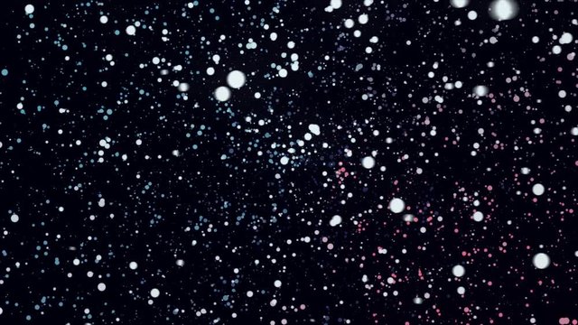 Many round colorful particles in space moving in a circle on black background, seamless loop. Animation. Small chaotic dots of red, yellow, blue colors flying in the dark.