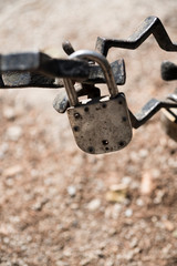rusty chain and padlocks hanging on bridge in  Brugge, Bruges, Belgium