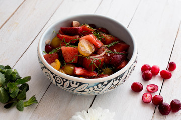 Fruit salad with orange, blueberry, strawberry, raspberry and mint. Berries. Homemade. Healthy food. Vitamin. Organic. Grapes. Diet. Dessert.