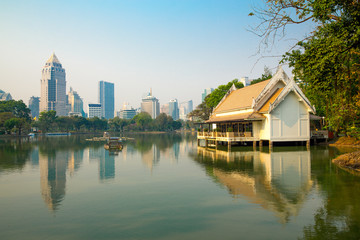Fototapeta na wymiar Lumphini Park in Bangkok. Bangkok skyline. View point at lake.