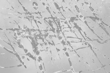 Silver, gray wet abstract paint leaks and splashes texture on white watercolor paper background. Natural organic shapes and design.